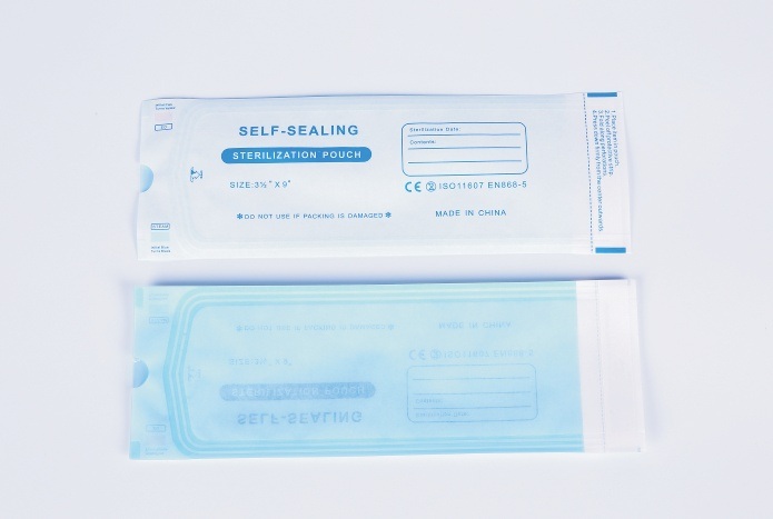 Self-sealing pouch, paper and film sides